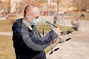 A man holds a quadrocopter