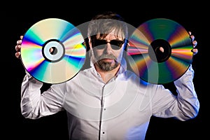 Man holds a retro laser discs
