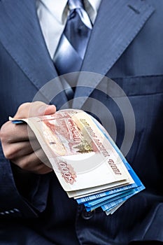 Businessman holding money hand