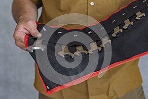 Man holds a set keys for car repair