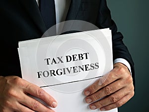 Man holds Tax debt forgiveness agreement