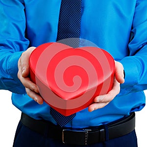 Man holds valentines gift box in the shape of heart.