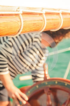 a man holds the wheel and prepares to pull it out