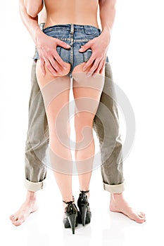 Man holds a woman's buttocks