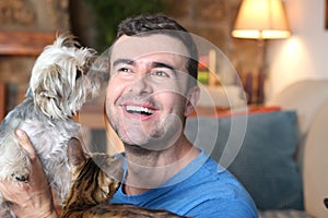 Man at home with cat and dog