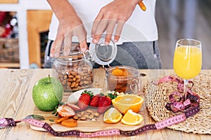 Man at home touching and eating fruits - indoor and sane lifestyle concept