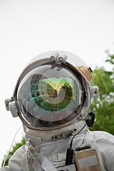 Man in a homemade spacesuit . Vertical shot . Technology and DIY concept