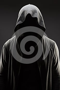 Man in the hood over grey background