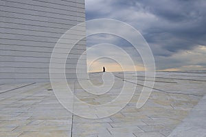 Man on the horizon against the background of storm clouds