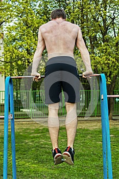 Man and horizontal bar