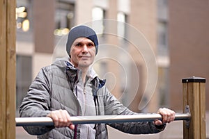 Man at a horizontal bar outdoors