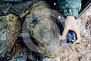 A man in a horizontal directional driller, holding a joystick