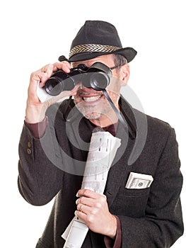 Man at the horse track with binoculars