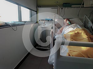 man in hospital bed