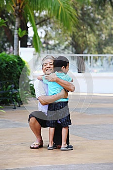 Man hugging his grandson. Conceptual image