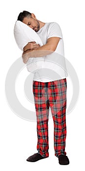 Man hugging pillow in sleepwalking state on white background