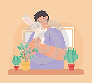 man hugging rabbit