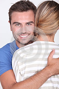 Man hugging a woman