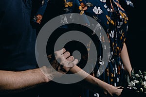 Man hugging a woman in a dress close-up