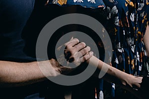 Man hugging a woman in a dress close-up