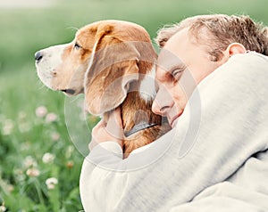 Man hugs his favorite dog