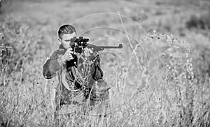 Man hunter aiming rifle nature background. Experience and practice lends success hunting. Guy hunting nature environment