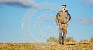 Man hunter carry rifle blue sky background. Experience and practice lends success hunting. Hunting weapon gun or rifle