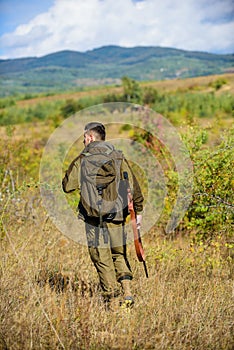 Man hunter carry rifle nature background. Experience and practice lends success hunting. Hunting season. Guy hunting