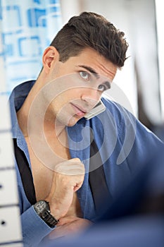 Man in a hurry front of mirror