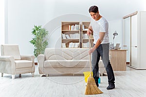 The man husband cleaning the house helping wife