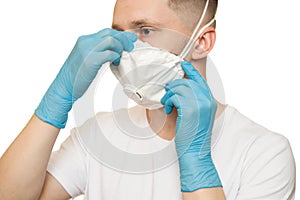 Man in hygienic mask and blue gloves Isolated on white background. Protection against contagious disease, coronavirus. Covid,