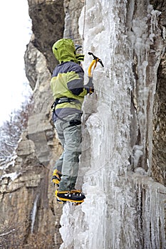 Man with ice axes and crampons