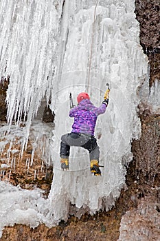 Man with ice axes and crampons photo