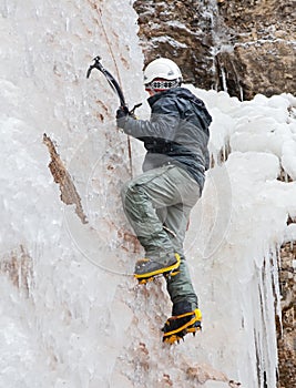 Man with ice axes and crampons