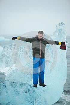 Man on Ice Block Looking into Water