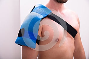 Man With A Ice Pack On His Shoulder photo