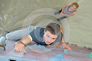 Man on indoor climbing wall