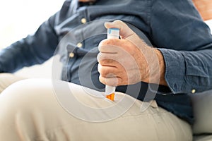 Man Injecting Epinephrine Using Auto-injector Syringe
