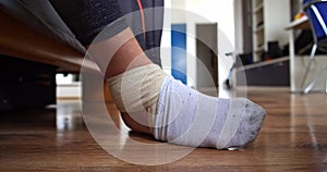Man with injured leg wearing a sock