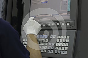 Man input data on cnc machine panel control