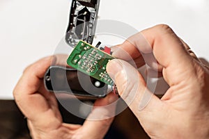 A man inserts an electronic board into