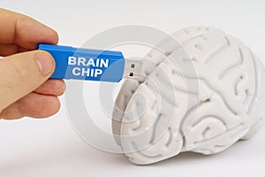 A man inserts a flash drive into his brain with the inscription - brain chip
