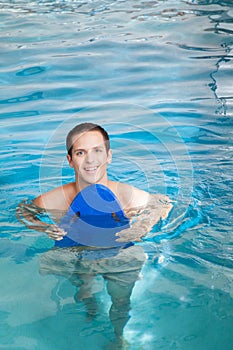 Man inside the pool with floater