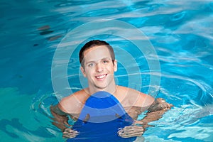 Man inside the pool with floater