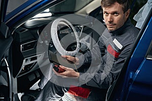 Man inspecting board computer system in the workshop