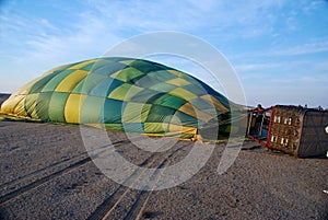 Man inspects the lines of the balloon
