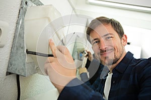 man during installation hand-dryer