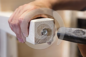 A Man is installing a adjustable screw