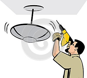 Man installing a ceiling lamp