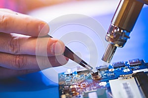 Man installing a chip on CPU board